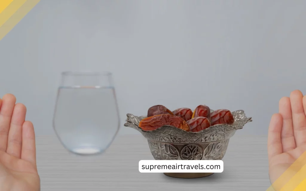 A person breaking their fast with a date, a traditional food eaten by Muslims during Ramadan